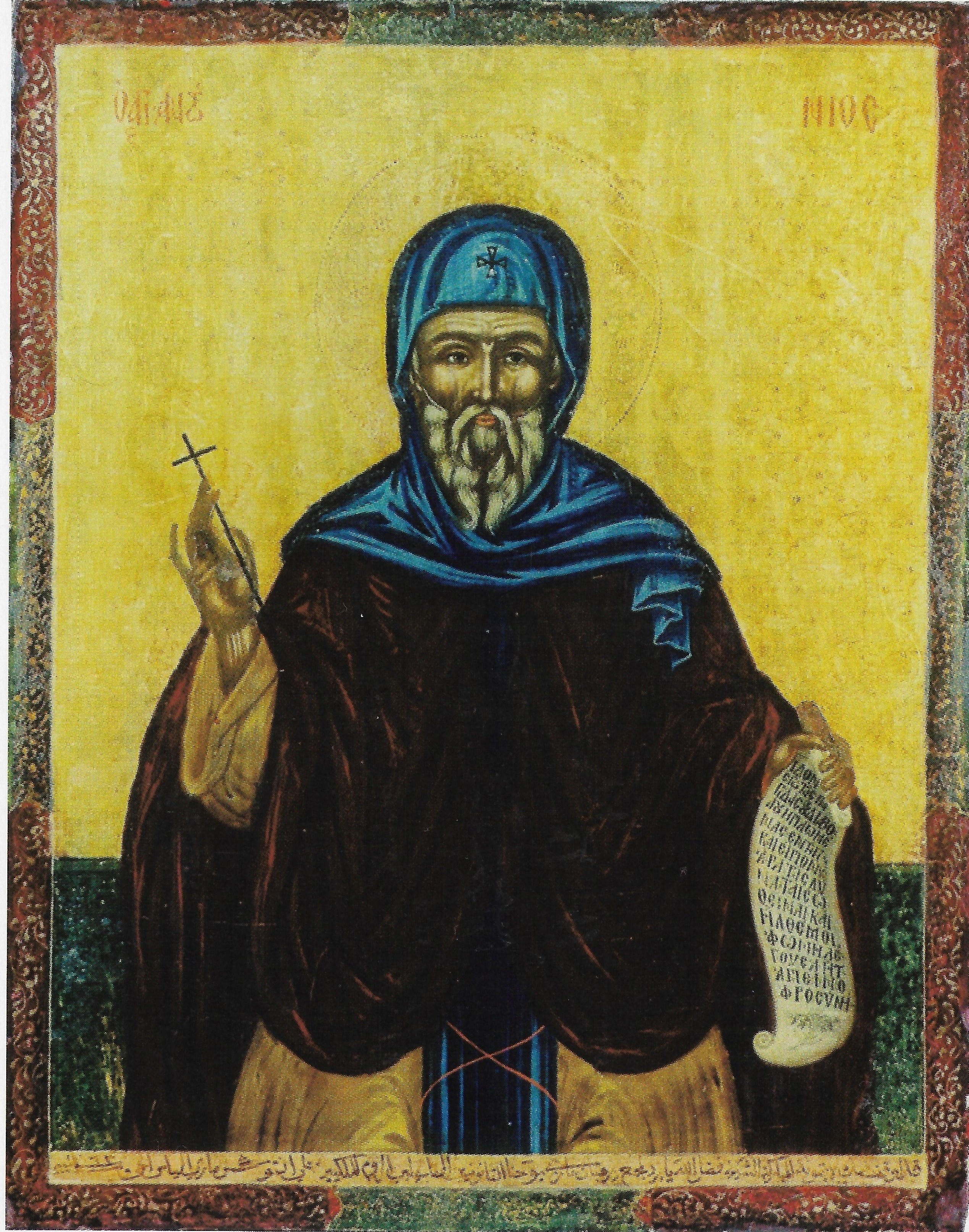 Icon of Saint Antony the Great holding a cross and a scroll