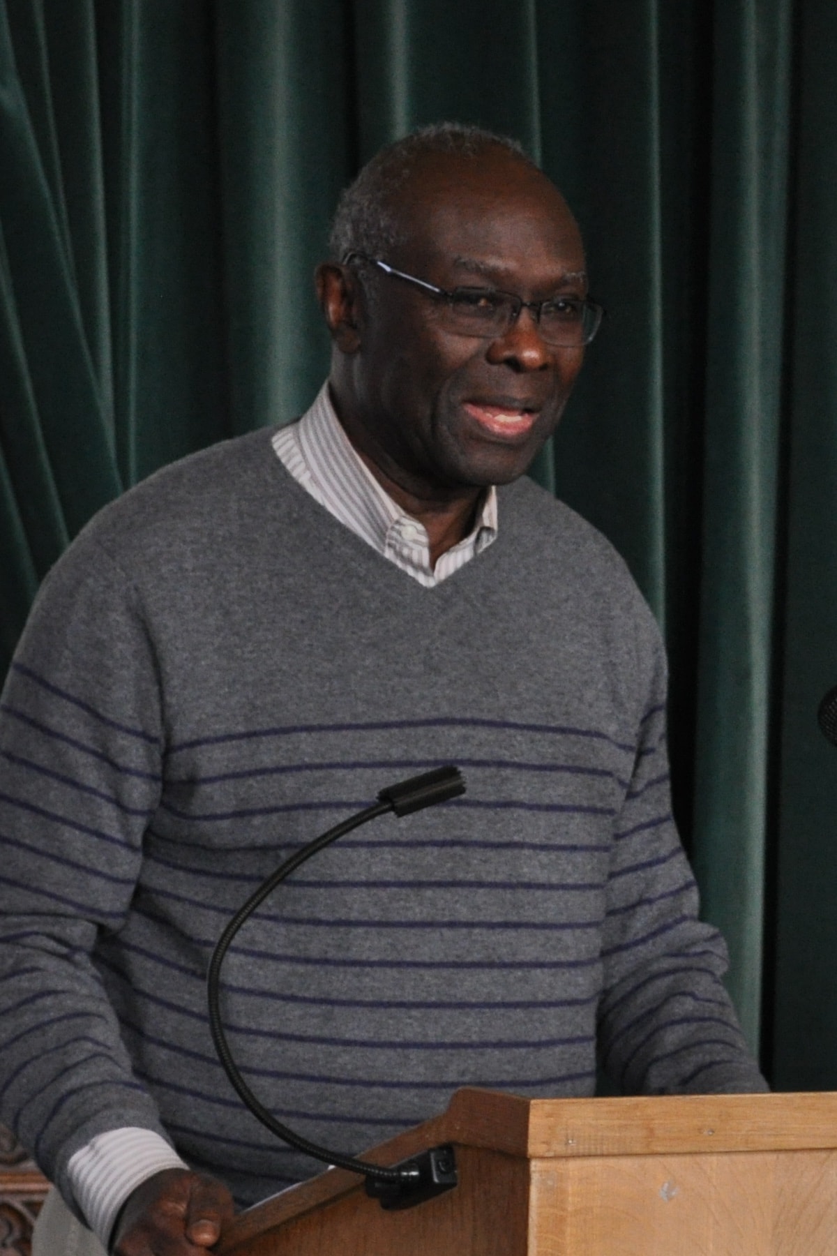 Portrait photograph of Lamin Sanneh at an academic conference