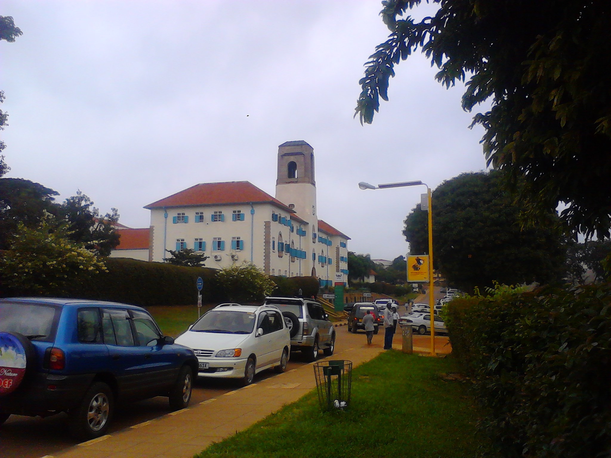 The white main building of Makerere University in Kampala, with a red tile roof and a square clock tower