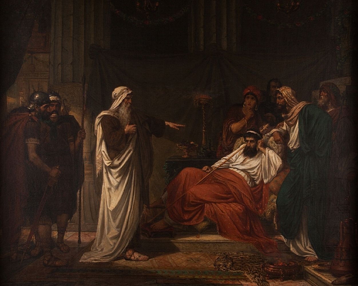 The prophet Nathan, standing, points at King David, who reclines on a couch in red robes, while courtiers look on