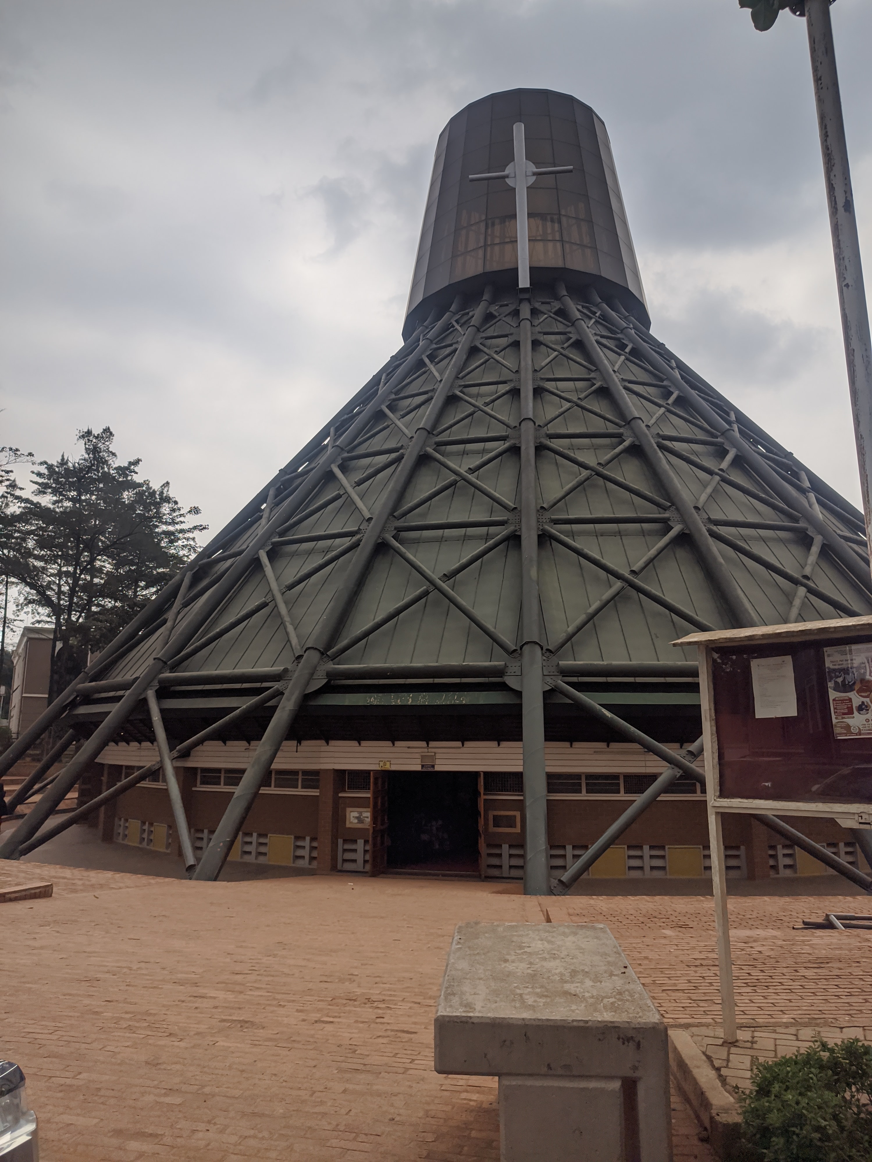The Basilica of the Uganda Martyrs at Namugongo, a tall cone-shaped church with a cross on its spire