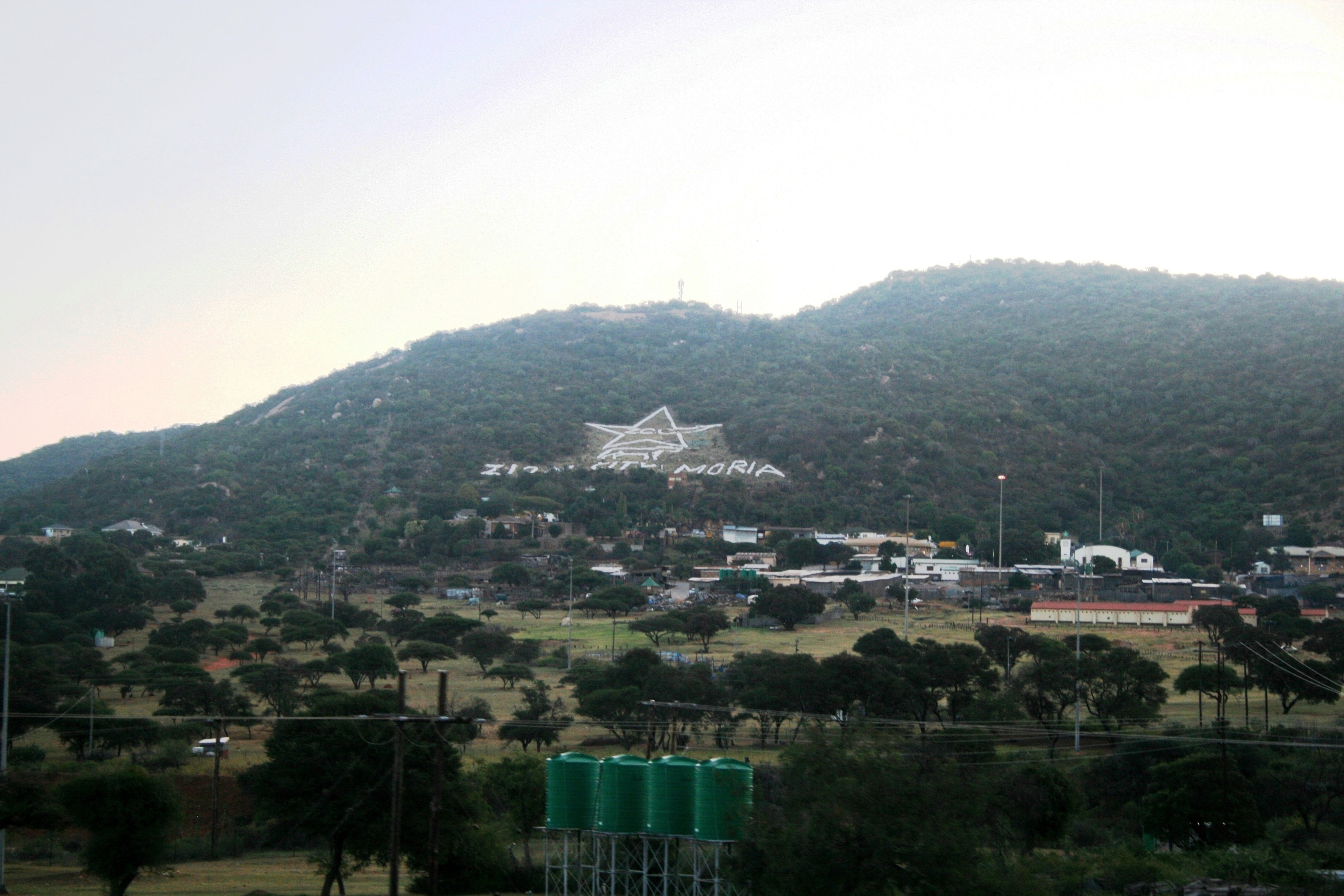 Zion City Moria in Limpopo, South Africa, with a large white star and the word Moria laid out on the hillside above the church grounds